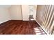 Spacious bedroom with hardwood floors and access to hallway at 2502 N Harding N St, Indianapolis, IN 46208