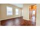 Bright bedroom with hardwood floors and access to other rooms at 2502 N Harding N St, Indianapolis, IN 46208