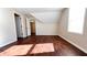 Bedroom with hardwood floors and access to another room at 2502 N Harding N St, Indianapolis, IN 46208