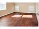Bedroom with hardwood floors and two windows at 2502 N Harding N St, Indianapolis, IN 46208