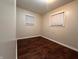 Spacious bedroom with neutral walls and dark hardwood floors at 2502 N Harding N St, Indianapolis, IN 46208