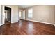 Bedroom with hardwood floors and access to another room at 2502 N Harding N St, Indianapolis, IN 46208