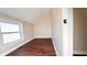 Small bedroom with wood-look flooring and a window at 2502 N Harding N St, Indianapolis, IN 46208