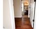 Hallway with hardwood floors and access to bedrooms and bathroom at 2502 N Harding N St, Indianapolis, IN 46208