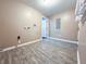 Laundry room with vinyl flooring and space for washer and dryer at 2502 N Harding N St, Indianapolis, IN 46208