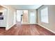 Bright living room featuring hardwood floors and an open staircase at 2502 N Harding N St, Indianapolis, IN 46208