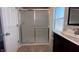 Clean shower with glass enclosure and built-in shelving at 2502 N Harding N St, Indianapolis, IN 46208