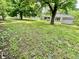 Large backyard with mature trees and plenty of space for outdoor activities at 2533 Aurie Dr, Indianapolis, IN 46219