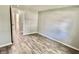 Simple bedroom with hardwood floors and access to hallway at 2533 Aurie Dr, Indianapolis, IN 46219
