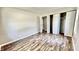 Bedroom with hardwood floors, closet, and access to another room at 2533 Aurie Dr, Indianapolis, IN 46219
