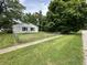 House exterior showcasing a ranch style home with a chain link fence at 2533 Aurie Dr, Indianapolis, IN 46219