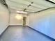 Spacious garage with extra storage and a convenient interior access door at 2533 Aurie Dr, Indianapolis, IN 46219