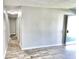 Hallway with wood-look flooring and neutral walls at 2533 Aurie Dr, Indianapolis, IN 46219
