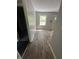 Bright living room featuring hardwood floors and a view of the backyard at 2533 Aurie Dr, Indianapolis, IN 46219