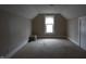 Spacious carpeted bedroom featuring a window and neutral wall paint at 30 N Muessing St, Indianapolis, IN 46229