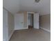 Carpeted bedroom with white doors and trim offers a simple, adaptable space at 30 N Muessing St, Indianapolis, IN 46229