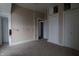 Large carpeted bedroom features closet space and adjoining room access at 30 N Muessing St, Indianapolis, IN 46229