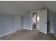 Cozy bedroom with carpet, features a built-in closet and open doorway at 30 N Muessing St, Indianapolis, IN 46229