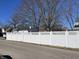 White vinyl fence with a lattice top along the property line at 30 N Muessing St, Indianapolis, IN 46229