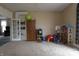Bright and inviting living room featuring carpet and lots of toy storage at 30 N Muessing St, Indianapolis, IN 46229