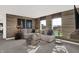 Bright bonus room with wood-look walls, comfortable seating, and large windows at 3608 Planck Cir, Danville, IN 46122