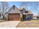 Charming two-story home with a nicely kept lawn, a two car garage, and blue skies at 368 Seabreeze Cir, Avon, IN 46123
