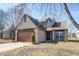Charming two-story home with a brick and vinyl exterior, attached garage, and manicured front yard at 368 Seabreeze Cir, Avon, IN 46123