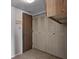 Compact laundry area featuring tiled floors and built in cabinets, with a utility closet at 368 Seabreeze Cir, Avon, IN 46123
