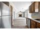 Open-concept living room with a fireplace, ceiling fan, and hardwood flooring that connects to the kitchen at 368 Seabreeze Cir, Avon, IN 46123