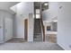 Inviting living room with neutral paint, an open stairway, and a glimpse into the adjacent living spaces at 368 Seabreeze Cir, Avon, IN 46123