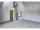 Spacious living room showcasing neutral tones, soaring ceilings, updated flooring, and an open staircase at 368 Seabreeze Cir, Avon, IN 46123