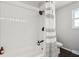 Clean bathroom with white subway tile and a shower/tub combo at 4155 Senour Rd, Indianapolis, IN 46239