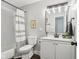 Updated bathroom with white vanity, subway tile, and gray walls at 4155 Senour Rd, Indianapolis, IN 46239