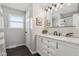 Modern bathroom with white cabinets and marble countertops at 4155 Senour Rd, Indianapolis, IN 46239