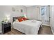 Bedroom with a queen bed, nightstands, and window at 4155 Senour Rd, Indianapolis, IN 46239