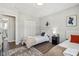 Two twin beds in a well-lit bedroom with a shared bathroom at 4155 Senour Rd, Indianapolis, IN 46239