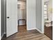 Bedroom with walk-in closet and wood-look floors at 4155 Senour Rd, Indianapolis, IN 46239