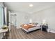 Bright bedroom with a queen bed and wood floors at 4155 Senour Rd, Indianapolis, IN 46239