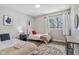 Two twin beds in a well-lit bedroom with a shared bathroom at 4155 Senour Rd, Indianapolis, IN 46239