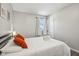 Bedroom with a queen bed, nightstands, and window at 4155 Senour Rd, Indianapolis, IN 46239