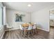Dining room with wooden table, white chairs, and large window at 4155 Senour Rd, Indianapolis, IN 46239