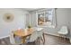 Bright dining area with a wood table and white chairs at 4155 Senour Rd, Indianapolis, IN 46239