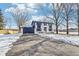 Two-story house with white brick and a navy blue garage at 4155 Senour Rd, Indianapolis, IN 46239