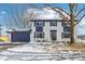 Two-story house with white brick, navy blue accents, and a spacious yard at 4155 Senour Rd, Indianapolis, IN 46239