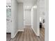 Bright hallway with wood-look floors and neutral walls at 4155 Senour Rd, Indianapolis, IN 46239