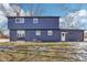 Rear view of a two story house with blue siding at 4155 Senour Rd, Indianapolis, IN 46239