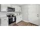 Modern kitchen with stainless steel appliances and white cabinets at 4155 Senour Rd, Indianapolis, IN 46239