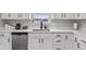 Modern kitchen with white cabinets, sink, and dishwasher at 4155 Senour Rd, Indianapolis, IN 46239