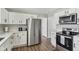 Modern kitchen with stainless steel appliances and white cabinets at 4155 Senour Rd, Indianapolis, IN 46239