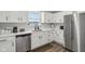 Modern kitchen with white cabinets, stainless steel appliances, and quartz countertops at 4155 Senour Rd, Indianapolis, IN 46239